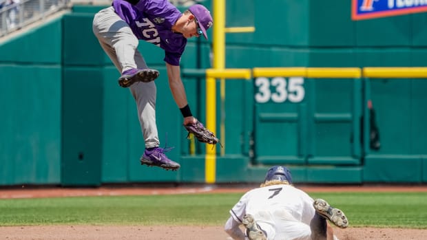 Jun 20, 2023; Omaha, NE, USA; Oral Roberts Golden Eagles center fielder Jonah Cox (7) steals second base against TCU Horned Frogs third baseman Brayden Taylor (55) during the fourth inning at Charles Schwab Field Omaha.